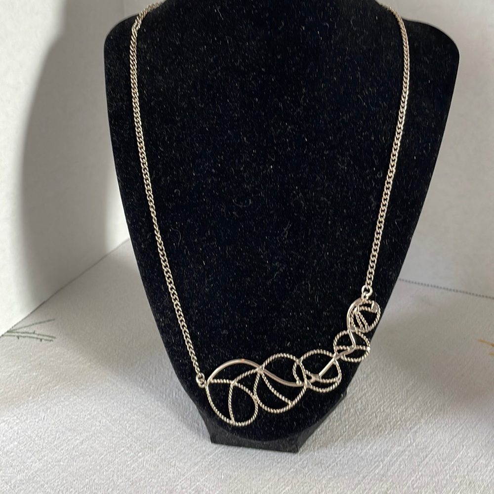 Silver toned necklace w rodeo, lasso/rope, western style necklace